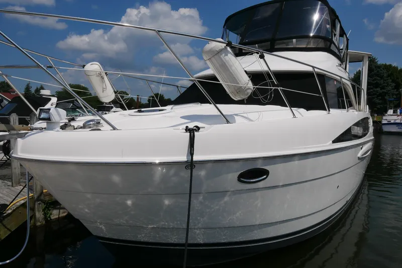 Slide: The Image of 2005 Meridian 368 Motoryacht docked under a clear blue sky. - 3