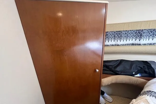 Slide: The Image of Interior cabin of 2005 Meridian 368 Motoryacht with wooden cabinet and patterned upholstery. - 39