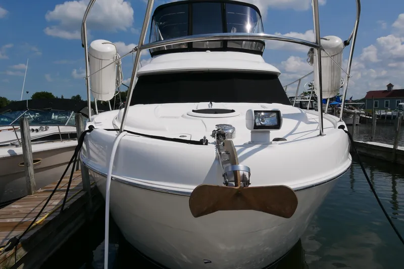 Slide: The Image of 2005 Meridian 368 Motoryacht docked at marina under blue sky. - 4