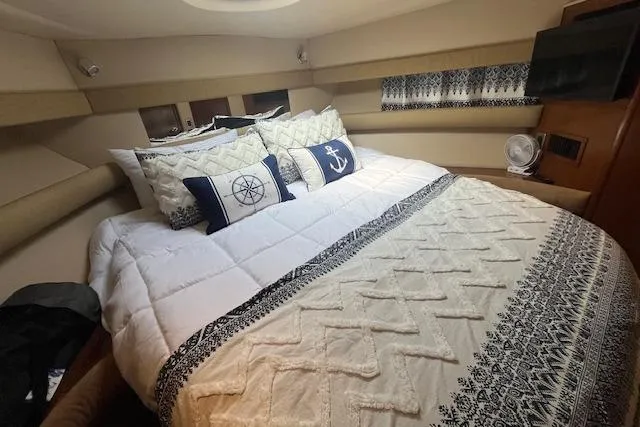 Slide: The Image of Luxurious bedroom in 2005 Meridian 368 Motoryacht with nautical-themed decor and cozy bedding. - 41