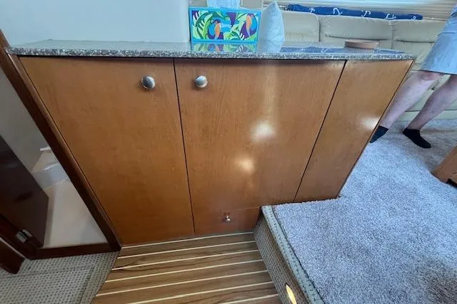 Slide: The Image of 2005 Meridian 368 Motoryacht interior with wooden cabinetry and carpeted flooring. - 48