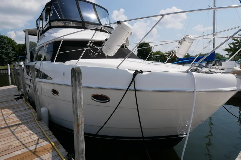 Slide: The Image of 2005 Meridian 368 Motoryacht docked at marina, featuring sleek design and modern amenities. - 5