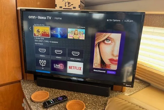 Slide: The Image of Onn Roku TV displaying streaming options inside a 2005 Meridian 368 Motoryacht. - 51