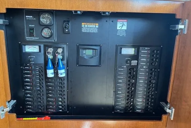 Slide: The Image of Electrical panel of 2005 Meridian 368 Motoryacht with gauges and switches. - 56