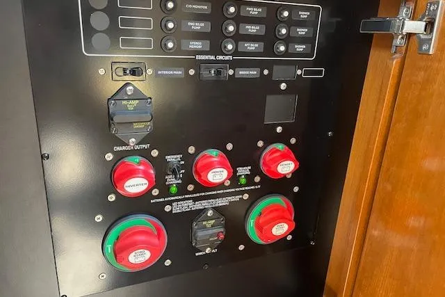 Slide: The Image of Electrical control panel on a 2005 Meridian 368 Motoryacht, featuring switches and circuit breakers. - 57