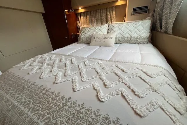 Slide: The Image of Luxurious bedroom interior of 2005 Meridian 368 Motoryacht with elegant bedding. - 59