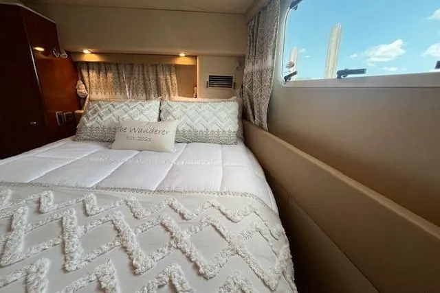 Slide: The Image of Luxurious bedroom interior of 2005 Meridian 368 Motoryacht with elegant bedding and window view. - 60