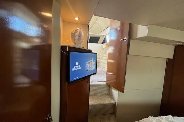 Slide: The Image of Interior of 2005 Meridian 368 Motoryacht with TV and wooden cabinetry. - 61