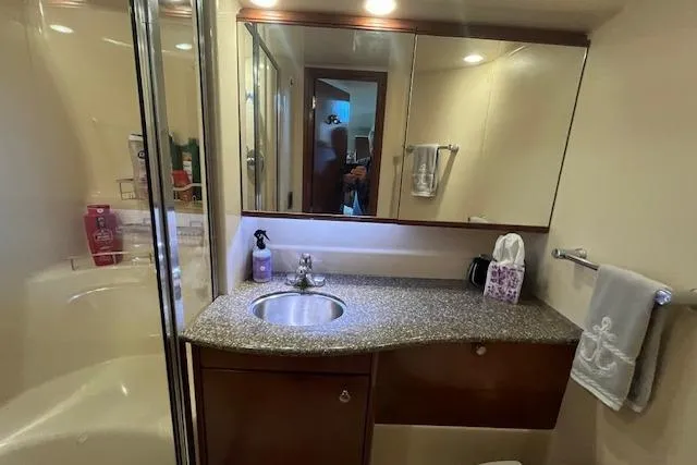 Slide: The Image of Luxurious bathroom in 2005 Meridian 368 Motoryacht with granite countertop and modern fixtures. - 62