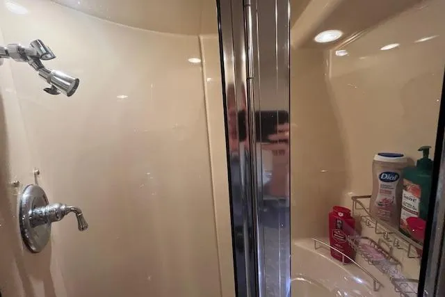 Slide: The Image of Shower area in 2005 Meridian 368 Motoryacht with toiletries and chrome fixtures. - 64