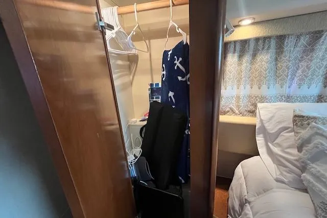 Slide: The Image of Interior of 2005 Meridian 368 Motoryacht showing closet and bed area. - 68