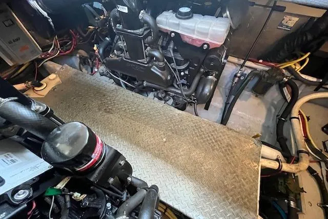 Slide: The Image of Engine room of a 2005 Meridian 368 Motoryacht, featuring mechanical components and wiring. - 69