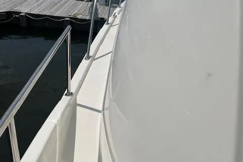 Slide: The Image of 2005 Meridian 368 Motoryacht deck with railing, docked at marina. - 7