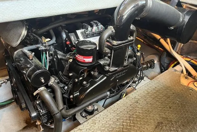 Slide: The Image of Engine compartment of a 2005 Meridian 368 Motoryacht, showcasing mechanical components and piping. - 71