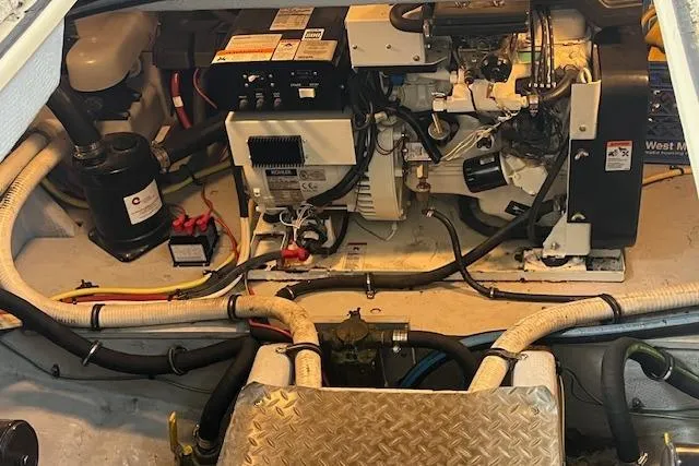 Slide: The Image of Engine room of a 2005 Meridian 368 Motoryacht, showcasing mechanical components and wiring. - 72