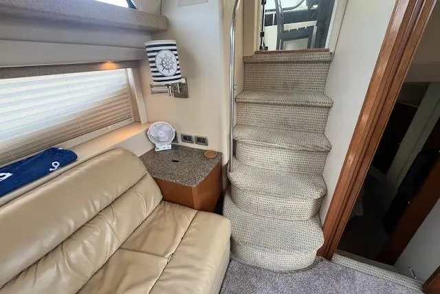 Slide: The Image of Interior of 2005 Meridian 368 Motoryacht with beige seating and carpeted stairs. - 74