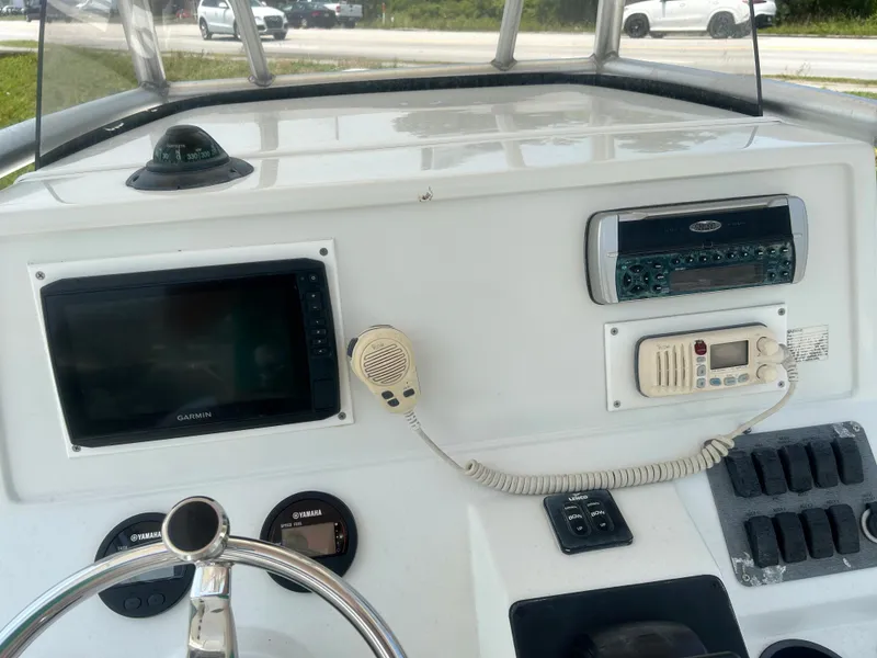 Slide: The Image of Console of 2004 Sailfish 236 CC boat with navigation and communication equipment. - 17