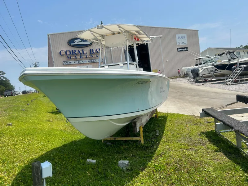 Slide: The Image of 2004 Sailfish 236 CC boat displayed outside Coral Bay Marina. - 7