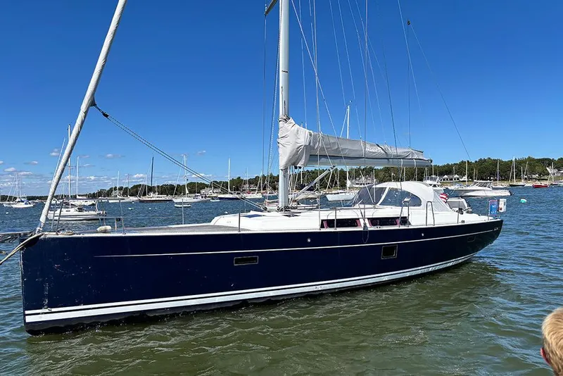 Slide: The Image of Sailing yacht Hanse 445, 2014 model, anchored in a scenic marina. - 1