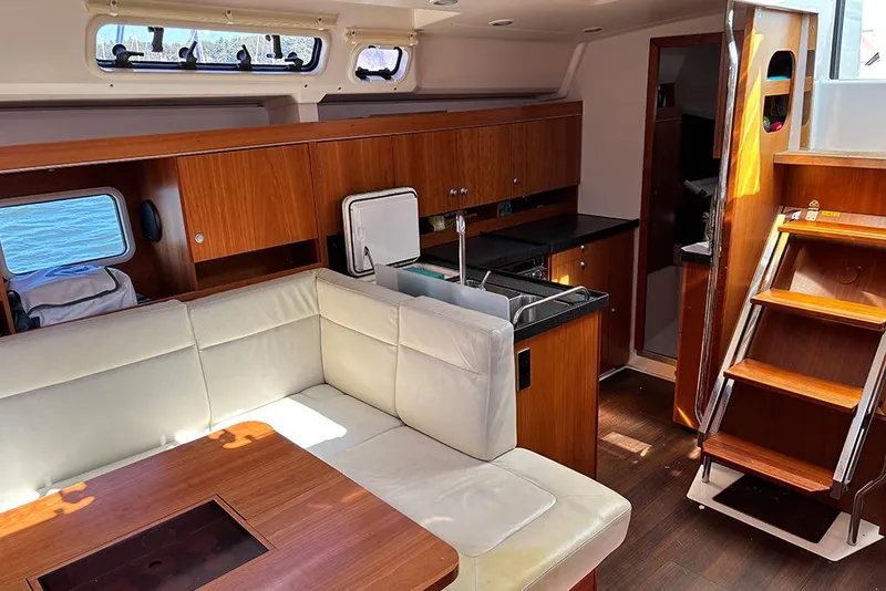 Slide: The Image of Interior of 2014 Hanse 445 yacht with modern kitchen and cozy seating area. - 15