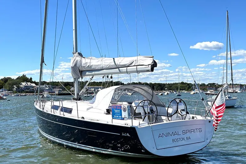 Slide: The Image of 2014 Hanse 445 sailboat "Animal Spirits" in Boston harbor, for sale, sunny day. - 2