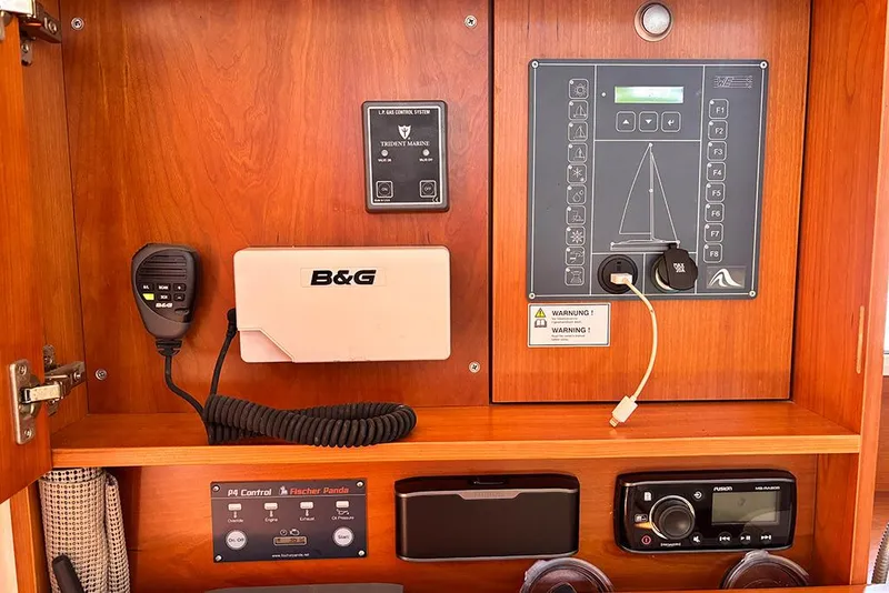 Slide: The Image of Control panel of a 2014 Hanse 445 yacht with navigation and communication equipment. - 21