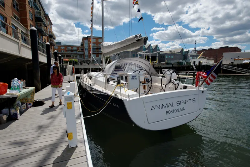 Slide: The Image of 2014 Hanse Yachts 445 sailboat docked in Boston marina under cloudy sky. - 5