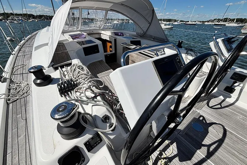 Slide: The Image of 2014 Hanse 445 yacht cockpit with dual steering wheels and nautical equipment. - 7