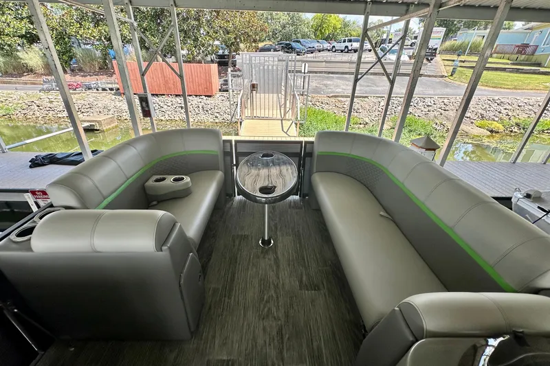 Slide: The Image of Interior of 2023 Qwest LT 820 pontoon boat with gray seating and table. - 14