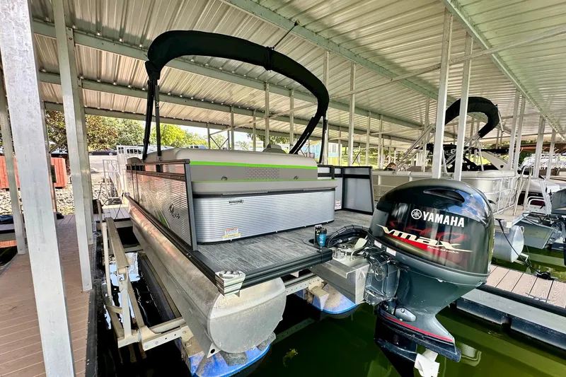 Slide: The Image of 2023 Qwest LT 820 pontoon boat with Yamaha outboard motor in covered dock. - 4