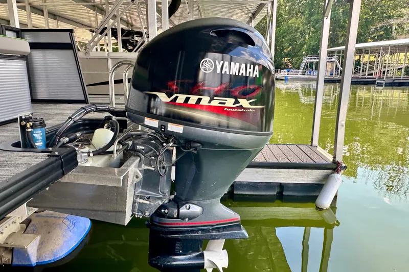 Slide: The Image of Yamaha VMAX outboard motor on 2023 Qwest LT 820 pontoon boat at dock. - 6