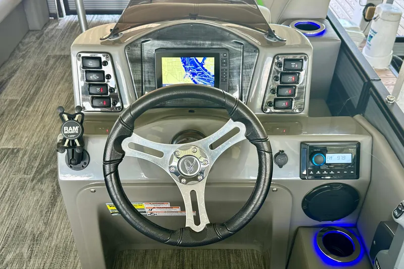 Slide: The Image of Steering console of 2023 Qwest LT 820 boat with navigation display and controls. - 7
