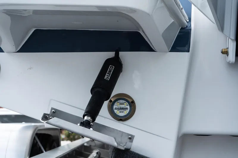 Slide: The Image of Close-up of 2026 Blackfin 262 HB boat's trim tab and underwater light. - 13