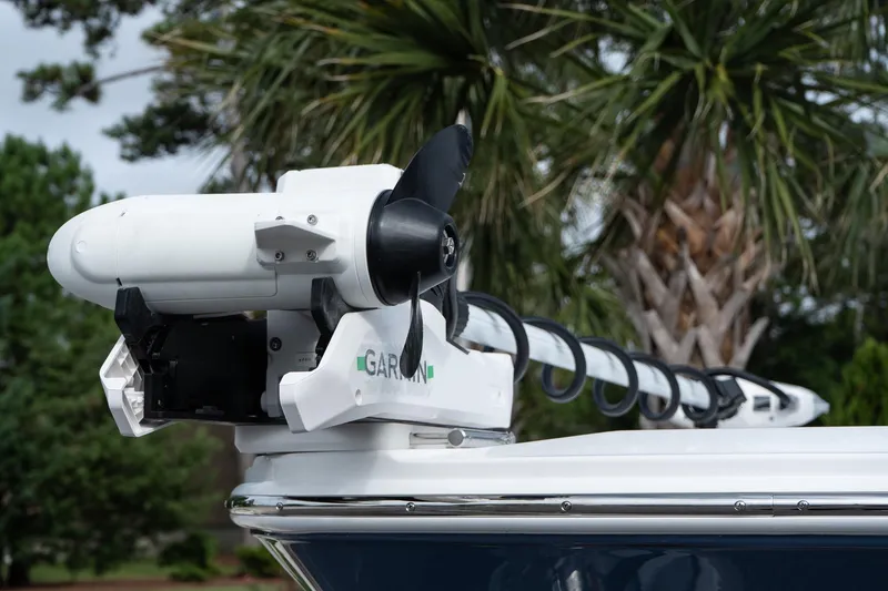 Slide: The Image of 2026 Blackfin 262 HB boat with Garmin trolling motor, palm trees in background. - 16