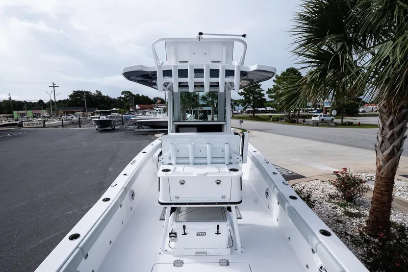 Slide: The Image of 2026 Blackfin 262 HB boat docked, showcasing sleek design and spacious deck. - 17