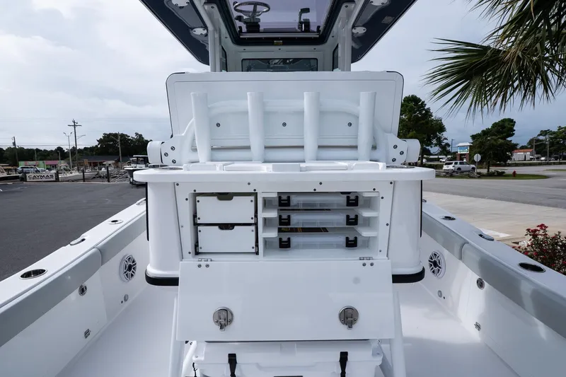 Slide: The Image of 2026 Blackfin 262 HB boat interior with storage compartments and rod holders. - 20