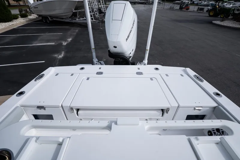 Slide: The Image of 2026 Blackfin 262 HB boat with Mercury engine in a parking lot. - 21
