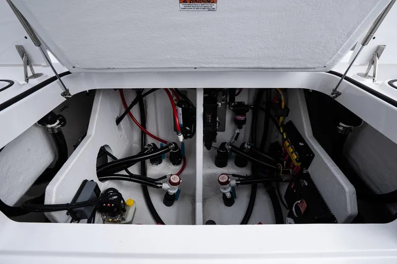 Slide: The Image of 2026 Blackfin 262 HB boat compartment with wiring and components. - 24