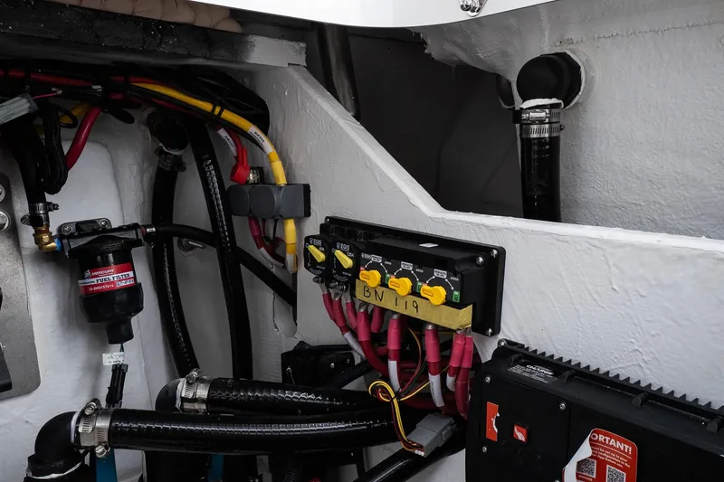 Slide: The Image of Electrical and fuel system components inside a 2026 Blackfin 262 HB boat. - 25