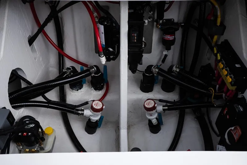 Slide: The Image of Engine compartment of a 2026 Blackfin 262 HB boat, showcasing wiring and components. - 26