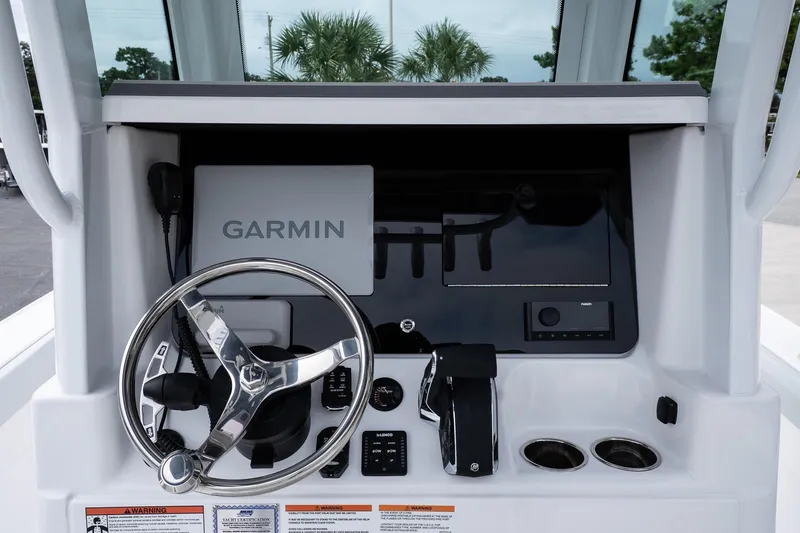 Slide: The Image of 2026 Blackfin 262 HB boat dashboard with Garmin navigation system and steering wheel. - 28