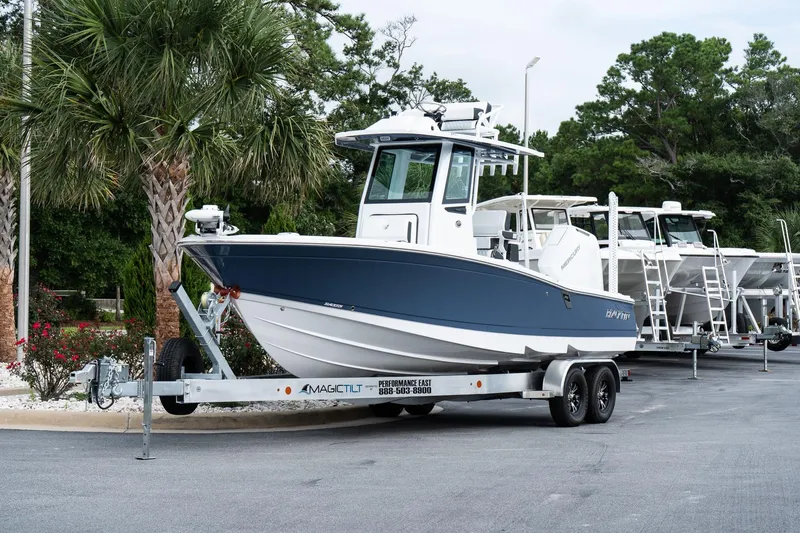 Slide: The Image of 2026 Blackfin 262 HB boat on trailer, parked near palm trees. - 3