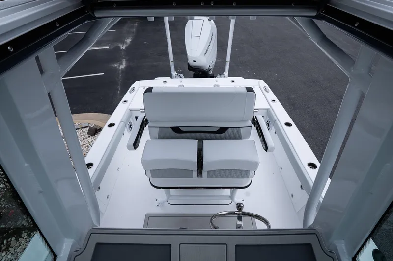 Slide: The Image of 2026 Blackfin 262 HB boat interior with dual seating and steering wheel. - 36