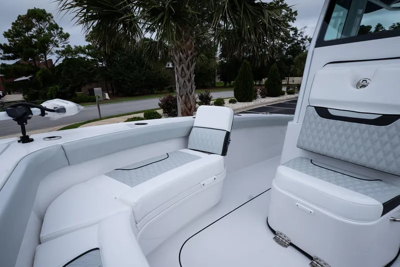 Slide: The Image of 2026 Blackfin 262 HB boat interior with white cushioned seating and sleek design. - 44