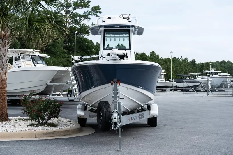 Slide: The Image of 2026 Blackfin 262 HB boat on trailer in marina parking lot. - 5