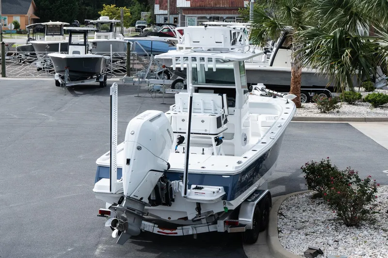 Slide: The Image of 2026 Blackfin 262 HB boat on trailer in marina parking lot. - 9