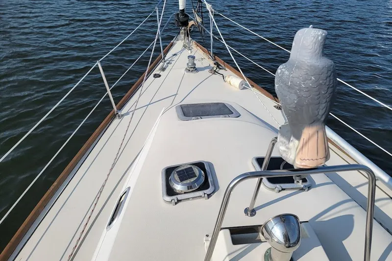 Slide: The Image of Deck view of 1987 Pearson 39-2 sailboat with 2016 Beta engine on calm water. - 27