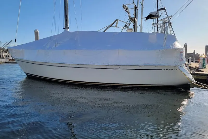 Slide: The Image of 1987 Pearson 39-2 sailboat with 2016 Beta engine, docked and covered. - 35