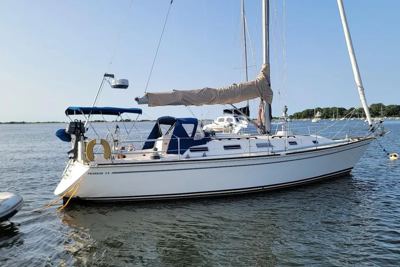 Slide: The Image of 1987 Pearson 39-2 sailboat with 2016 Beta engine, anchored in calm waters. - 20