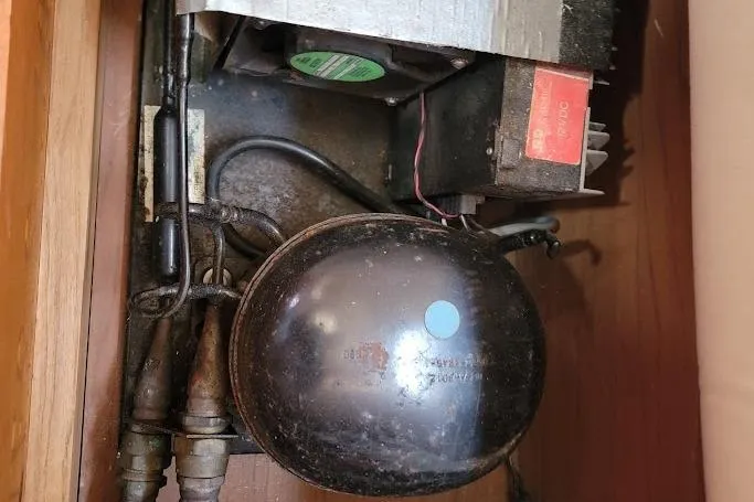 Slide: The Image of Engine compartment of 1987 Pearson 39-2 with 2016 Beta engine, showing mechanical components. - 26